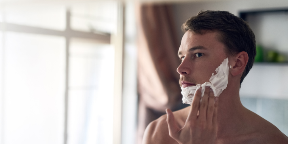 Razor Burn Treatment man using shaving cream